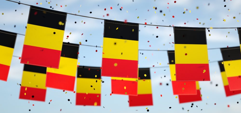 Belgians flags in the sky with confetti.